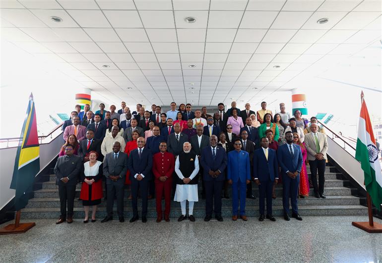 PM in a group photograph during the Special Session of the Parliament of Guyana at Georgetown, in Guyana on November 21, 2024.