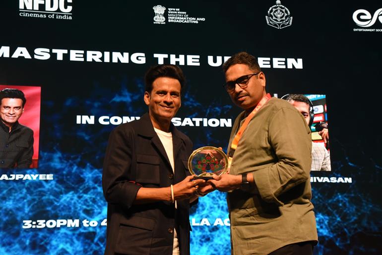 Shri Sanjay Jaju, Secretary, MIB felicitates Shri Manoj Bajpayee at 55th IFFI, in Goa on November 21, 2024.