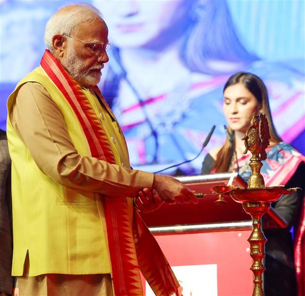 PM lighting the lamp at the ‘Odisha Parba 2024’ celebrations, in New Delhi on November 24, 2024.
