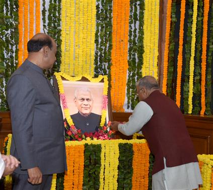 The Deputy Chairman of Rajya Sabha, Shri Harivansh paying floral tributes to former Lok Sabha Speaker, Shri Rabi Ray on the occasion of his birth anniversary at Central Hall of Samvidhan Sadan, in New Delhi on November 26, 2024.