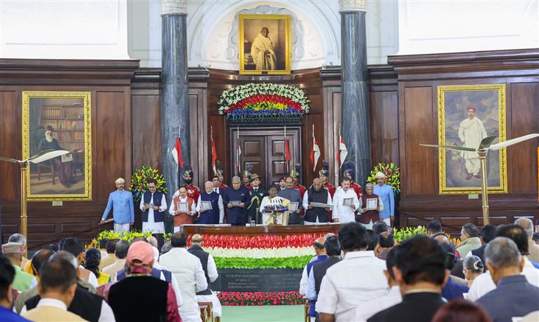 The President of India, Smt. Droupadi Murmu, the Vice President of India, Shri Jagdeep Dhankhar and PM attend Constitution Day 2024 celebrations at Central Hall, in Parliament House, New Delhi on November 26, 2024.