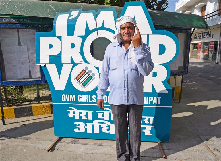 A male voter showing mark of indelible ink after casting his vote at a polling booth during the Legislative Assembly Elections 2024 at G.V.M. Girls College in Sonipat, Haryana on October 05, 2024.