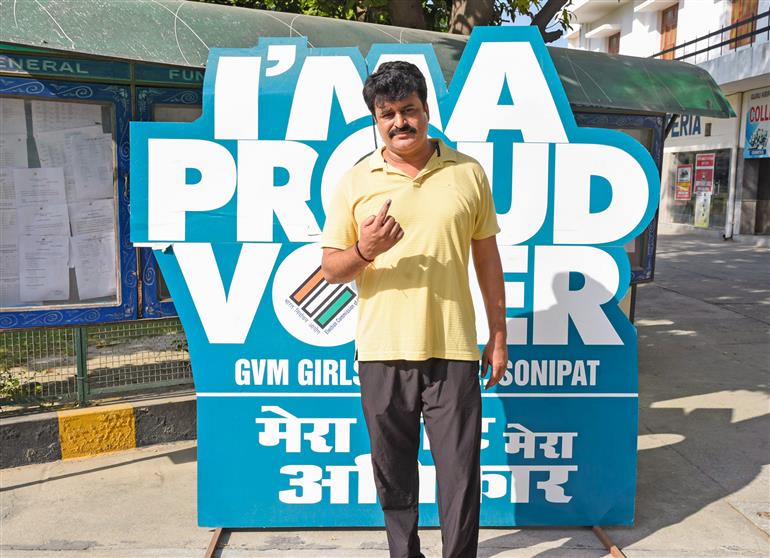 A male voter showing mark of indelible ink after casting his vote at a polling booth during the Legislative Assembly Elections 2024 at G.V.M. Girls College in Sonipat, Haryana on October 05, 2024.