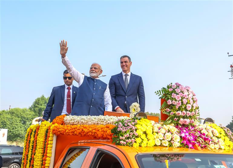 PM along with the Prime Minister of Spain, Mr. Pedro Sanchez receive warm welcome by people during their roadshow at Vadodara, in Gujarat on October 28, 2024.