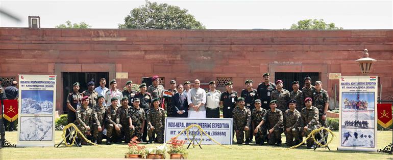 The Union Minister for Defence, Shri Rajnath Singh in a group photograph at the flagging off ceremony of expeditions to Mount Everest (8,848m) and Mount Kangchenjunga (8,586m) at South Block, in New Delhi on April 03, 2025.
