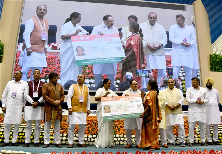The Union Minister of Health and Family Welfare & Chemicals and Fertilizers, Shri Jagat Prakash Nadda and the Chief Minister of Delhi, Smt. Rekha Gupta distribute Ayushman Cards to beneficiaries, in New Delhi on April 10, 2025.