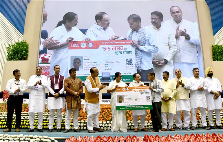 The Union Minister of Health and Family Welfare & Chemicals and Fertilizers, Shri Jagat Prakash Nadda and the Chief Minister of Delhi, Smt. Rekha Gupta distribute Ayushman Cards to beneficiaries, in New Delhi on April 10, 2025.