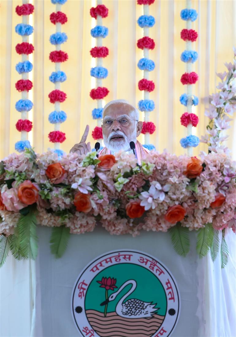 PM addressing the gathering during the visit of the Anandpur Dham, in Madhya Pradesh on April 11, 2025.