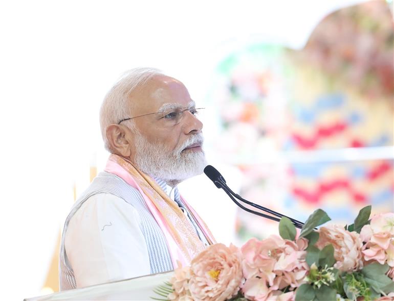PM addressing the gathering during the visit of the Anandpur Dham, in Madhya Pradesh on April 11, 2025.