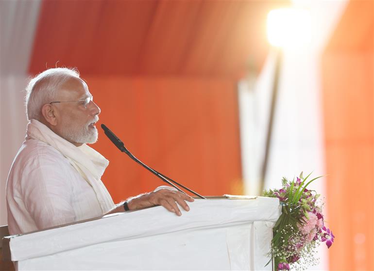 PM addressing the gathering at public event held on the sidelines of the foundation stone laying and inauguration of the multiple development projects at Varanasi, in Uttar Pradesh on August 02, 2025.