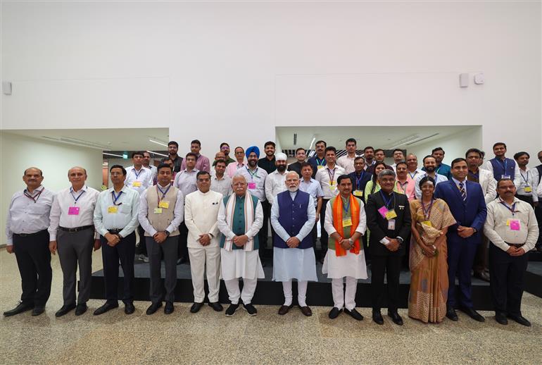PM in a group photograph during the inauguration of Kartavya Bhavan, in New Delhi on August 06, 2025.