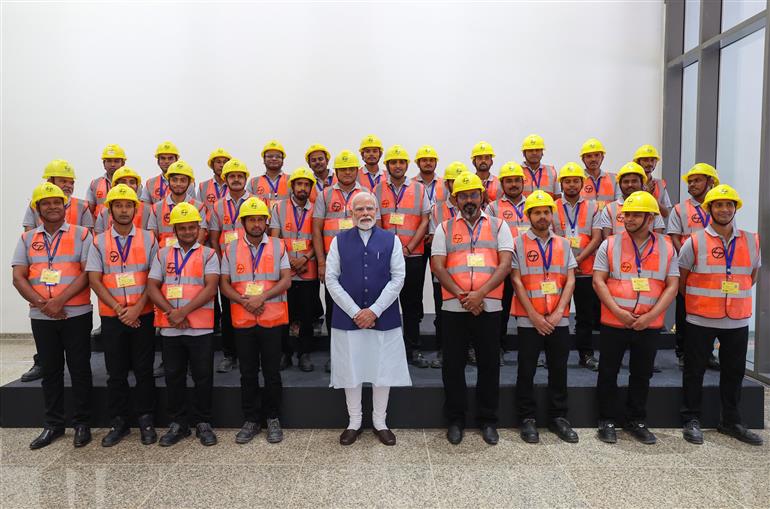 PM in a group photograph during the inauguration of Kartavya Bhavan, in New Delhi on August 06, 2025.