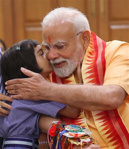 PM celebrates the festival of Raksha Bandhan with children from different schools at his residence (7, Lok Kalyan Marg), in New Delhi on August 09, 2025.