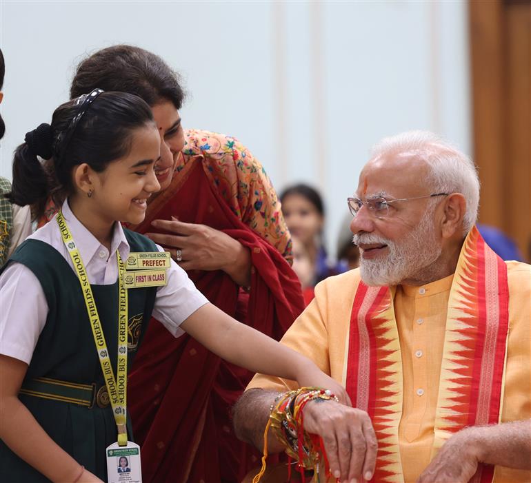PM celebrates the festival of Raksha Bandhan with children from different schools at his residence (7, Lok Kalyan Marg), in New Delhi on August 09, 2025.