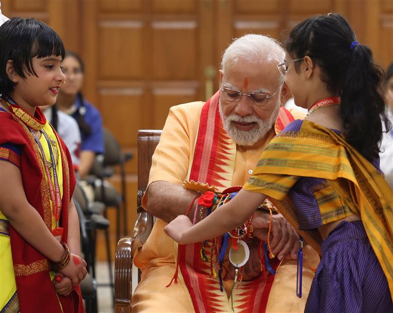 PM celebrates the festival of Raksha Bandhan with children from different schools at his residence (7, Lok Kalyan Marg), in New Delhi on August 09, 2025.
