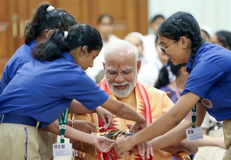 PM celebrates the festival of Raksha Bandhan with children from different schools at his residence (7, Lok Kalyan Marg), in New Delhi on August 09, 2025.