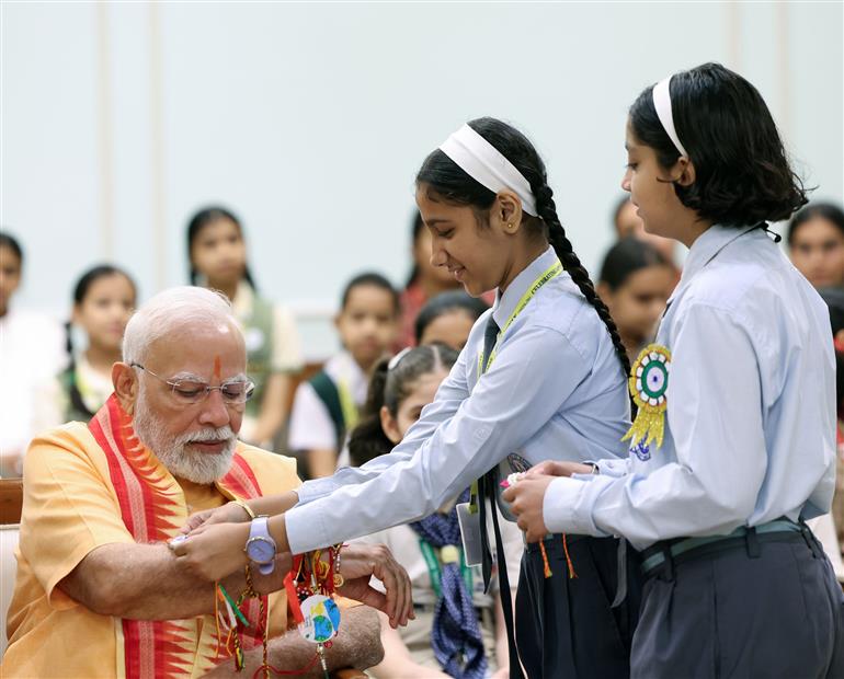 PM celebrates the festival of Raksha Bandhan with children from different schools at his residence (7, Lok Kalyan Marg), in New Delhi on August 09, 2025.
