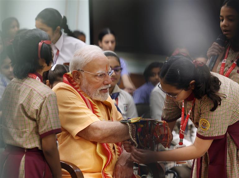 PM celebrates the festival of Raksha Bandhan with children from different schools at his residence (7, Lok Kalyan Marg), in New Delhi on August 09, 2025.