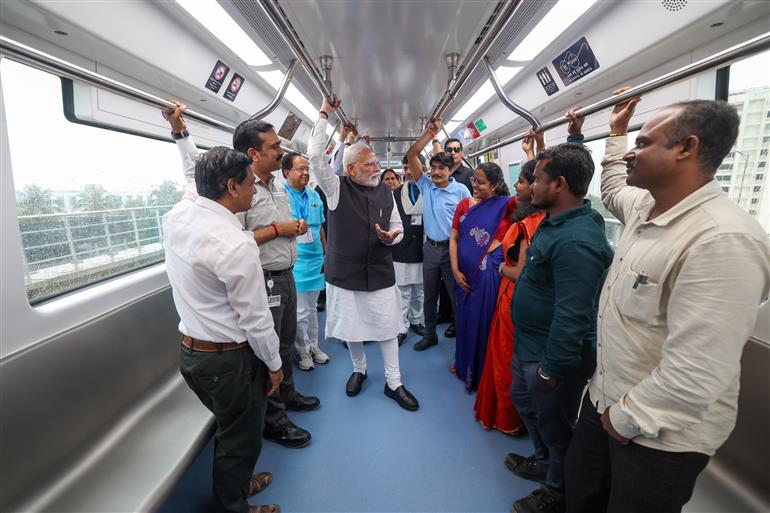 PM undertakes a Metro ride from RV Road (Ragigudda) to Electronic City metro station on the sidelines of the flagging-off ceremony of Yellow line of Bangalore metro at Bengaluru, in Karnataka on August 10, 2025.