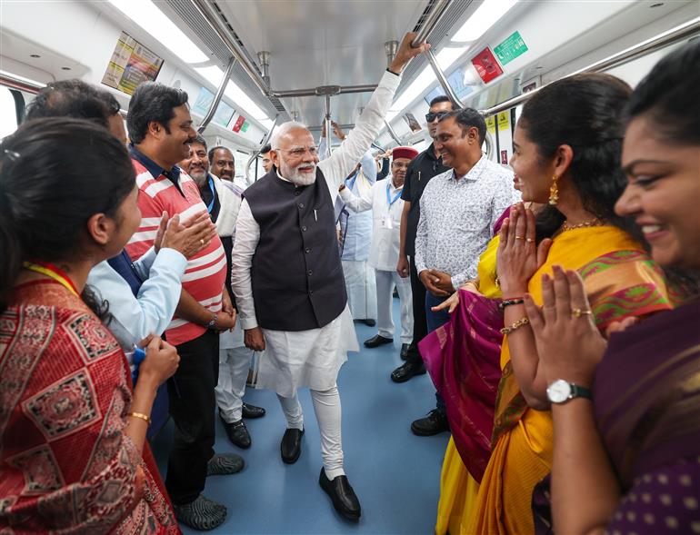 PM undertakes a Metro ride from RV Road (Ragigudda) to Electronic City metro station on the sidelines of the flagging-off ceremony of Yellow line of Bangalore metro at Bengaluru, in Karnataka on August 10, 2025.