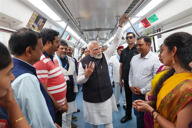 PM undertakes a Metro ride from RV Road (Ragigudda) to Electronic City metro station on the sidelines of the flagging-off ceremony of Yellow line of Bangalore metro at Bengaluru, in Karnataka on August 10, 2025.