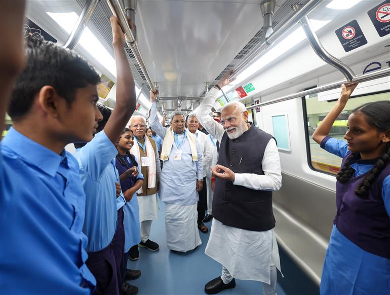 PM undertakes a Metro ride from RV Road (Ragigudda) to Electronic City metro station on the sidelines of the flagging-off ceremony of Yellow line of Bangalore metro at Bengaluru, in Karnataka on August 10, 2025.