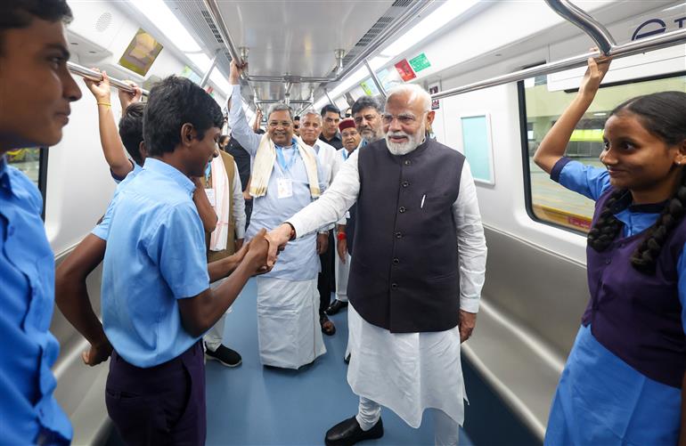PM undertakes a Metro ride from RV Road (Ragigudda) to Electronic City metro station on the sidelines of the flagging-off ceremony of Yellow line of Bangalore metro at Bengaluru, in Karnataka on August 10, 2025.