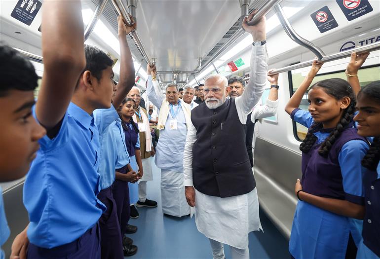 PM undertakes a Metro ride from RV Road (Ragigudda) to Electronic City metro station on the sidelines of the flagging-off ceremony of Yellow line of Bangalore metro at Bengaluru, in Karnataka on August 10, 2025.