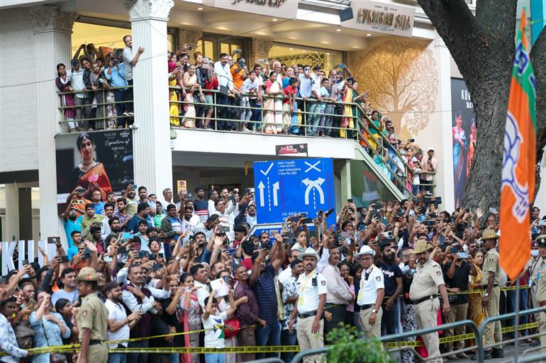 PM receives warm welcome by enthusiastic crowd during the Road Show on his arrival at Bengaluru, in Karnataka on August 10, 2025.