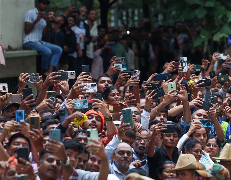 PM receives warm welcome by enthusiastic crowd during the Road Show on his arrival at Bengaluru, in Karnataka on August 10, 2025.