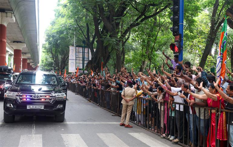 PM receives warm welcome by enthusiastic crowd during the Road Show on his arrival at Bengaluru, in Karnataka on August 10, 2025.