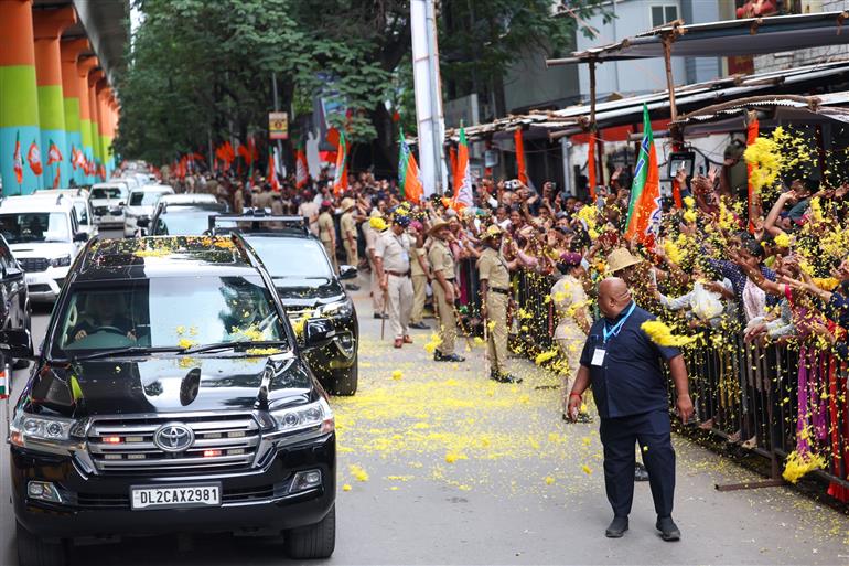 PM receives warm welcome by enthusiastic crowd during the Road Show on his arrival at Bengaluru, in Karnataka on August 10, 2025.