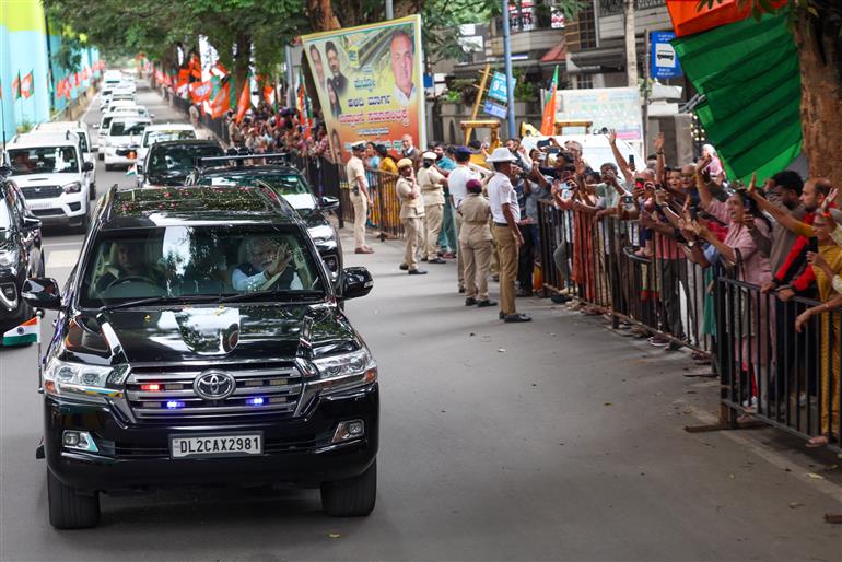 PM receives warm welcome by enthusiastic crowd during the Road Show on his arrival at Bengaluru, in Karnataka on August 10, 2025.