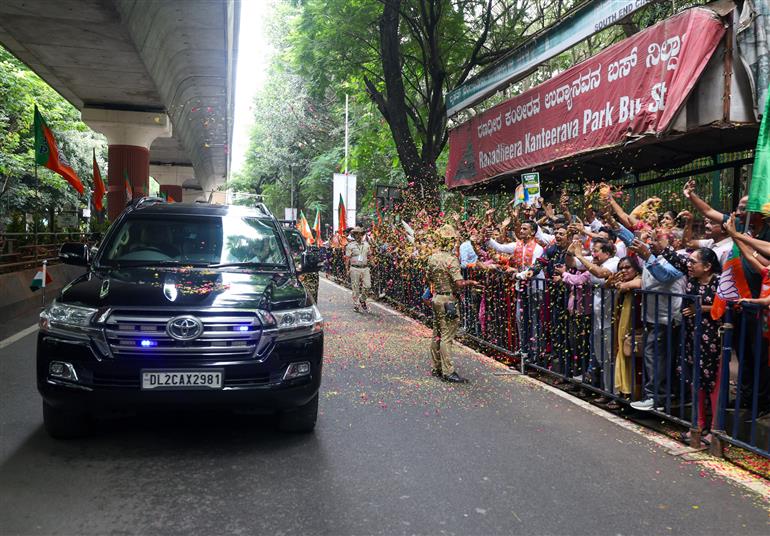PM receives warm welcome by enthusiastic crowd during the Road Show on his arrival at Bengaluru, in Karnataka on August 10, 2025.
