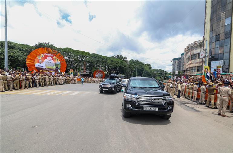 PM receives warm welcome by enthusiastic crowd during the Road Show on his arrival at Bengaluru, in Karnataka on August 10, 2025.
