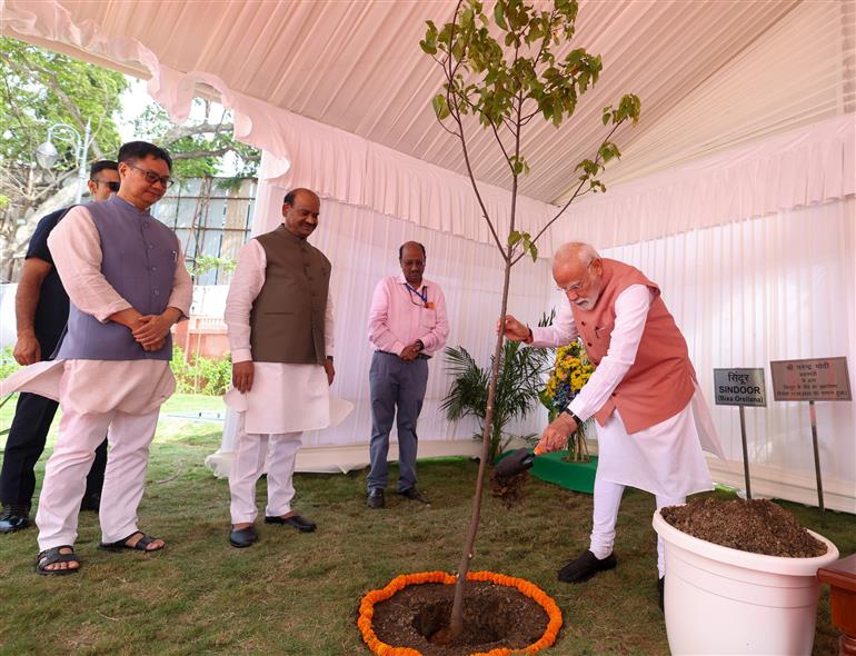 PM planting a sapling during the inauguration of newly constructed flats for Members of Parliament, in New Delhi on August 11, 2025.