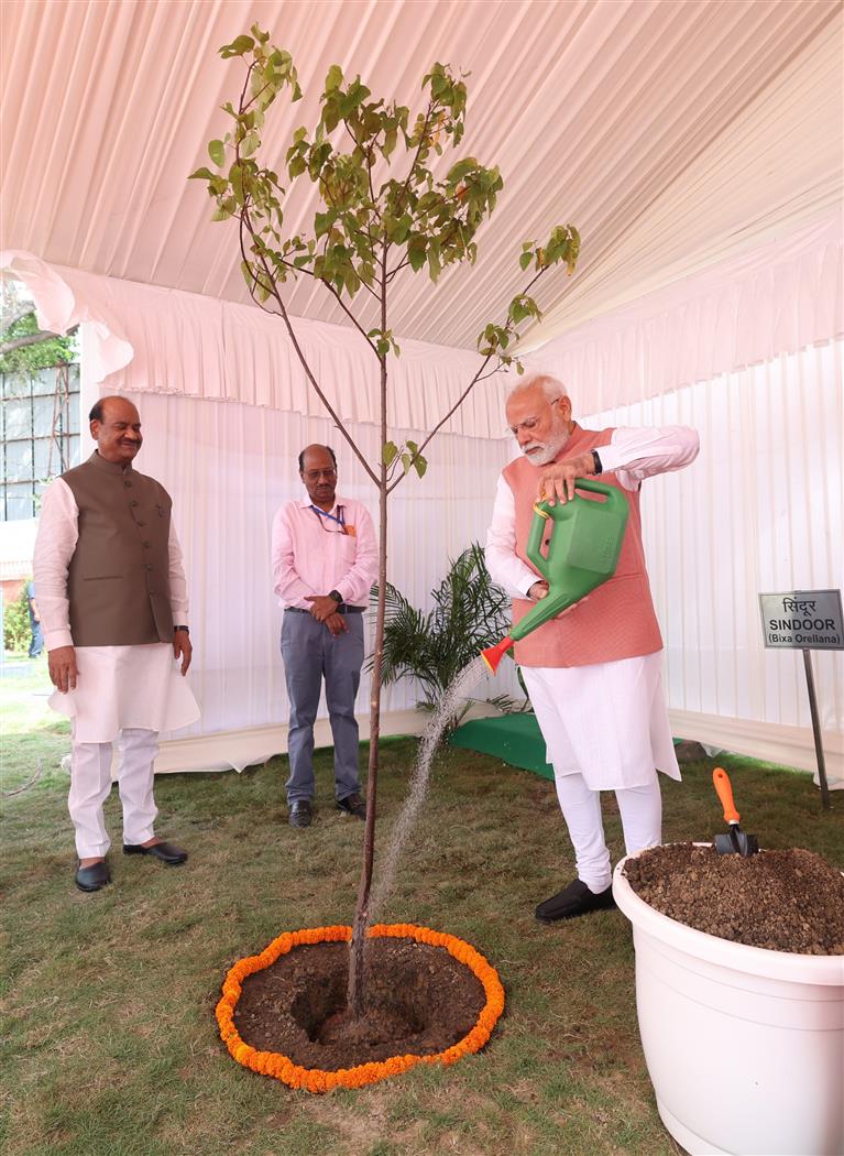 PM planting a sapling during the inauguration of newly constructed flats for Members of Parliament, in New Delhi on August 11, 2025.