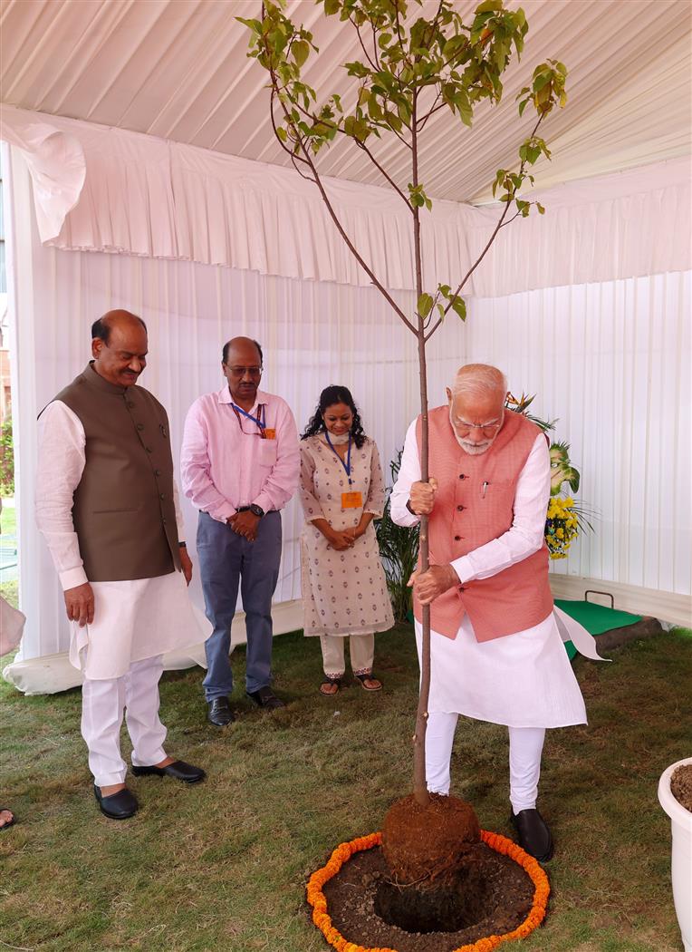 PM planting a sapling during the inauguration of newly constructed flats for Members of Parliament, in New Delhi on August 11, 2025.