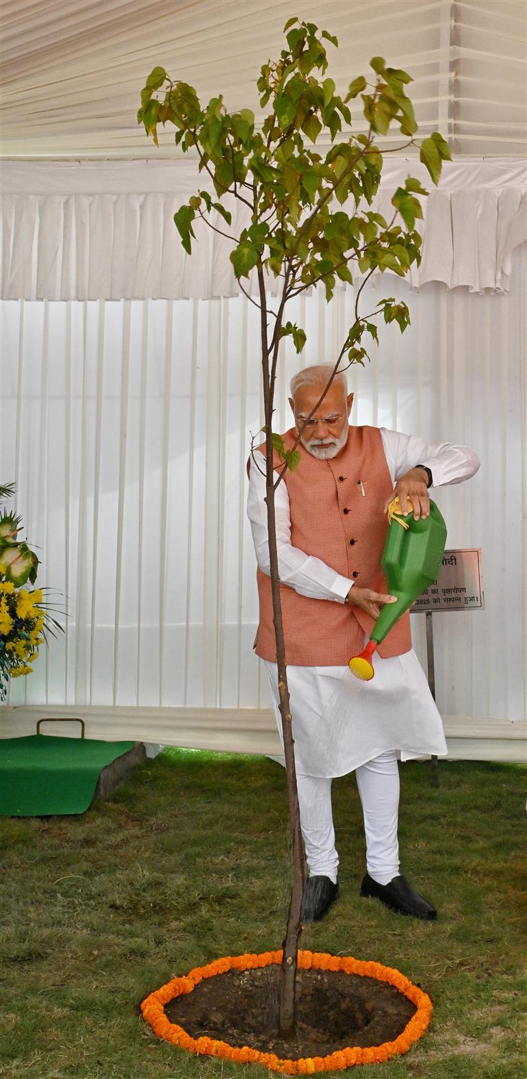 PM planting a sapling during the inauguration of newly constructed flats for Members of Parliament, in New Delhi on August 11, 2025.