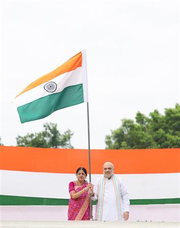 
The Union Minister for Home Affairs and Cooperation, Shri Amit Shah hoists Tiranga under ‘Har Ghar Tiranga campaign’ at his residence, in New Delhi on August 13, 2025.
