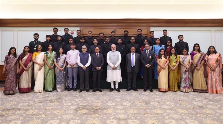 PM in a group photograph with the Officer Trainees of the 2024 Batch of Indian Foreign Service (IFS) at his residence (7, Lok Kalyan Marg), in New Delhi on August 19, 2025.