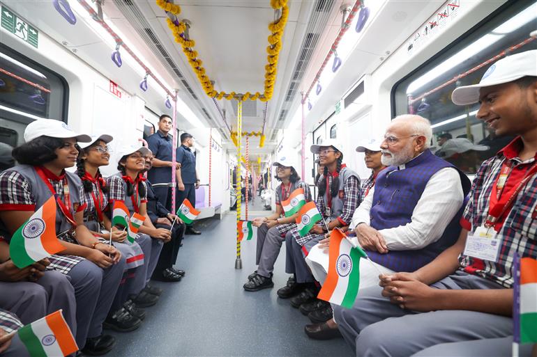 PM undertakes a metro ride at Kolkata, in West Bengal on August 22, 2025.