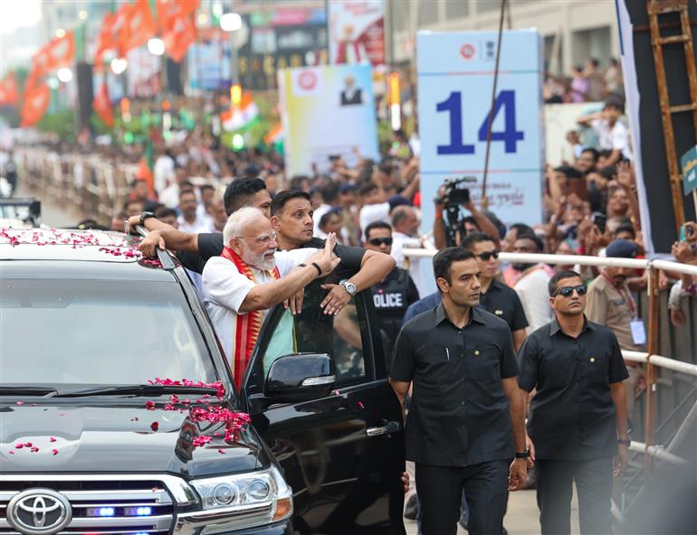 PM receives warm welcome by enthusiastic crowd during the Grand Road Show on his arrival at Ahmedabad, in Gujarat on August 25, 2025. 