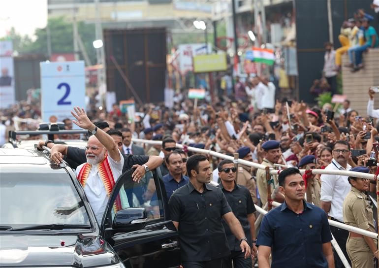 PM receives warm welcome by enthusiastic crowd during the Grand Road Show on his arrival at Ahmedabad, in Gujarat on August 25, 2025. 