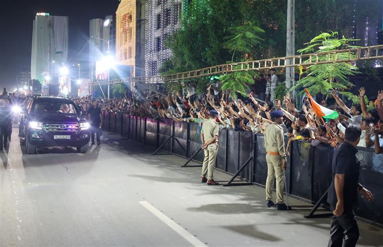 PM receives warm welcome by enthusiastic crowd during the Grand Road Show on his arrival at Ahmedabad, in Gujarat on August 25, 2025. 