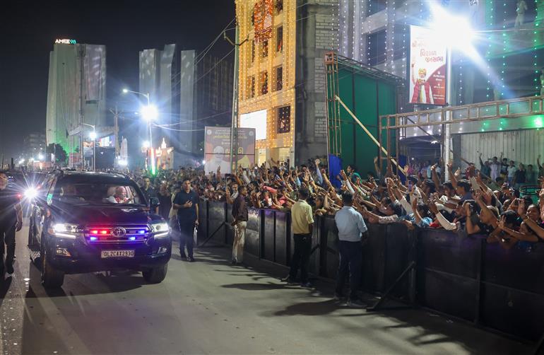 PM receives warm welcome by enthusiastic crowd during the Grand Road Show on his arrival at Ahmedabad, in Gujarat on August 25, 2025. 