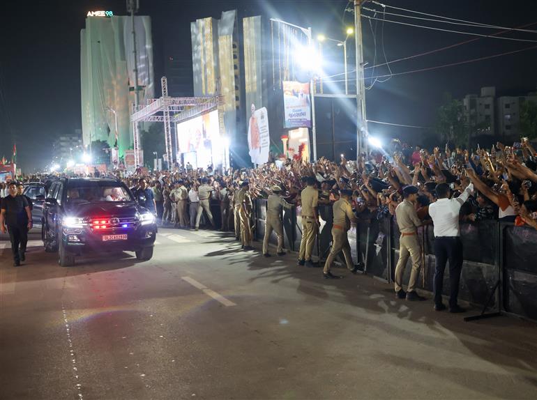 PM receives warm welcome by enthusiastic crowd during the Grand Road Show on his arrival at Ahmedabad, in Gujarat on August 25, 2025. 