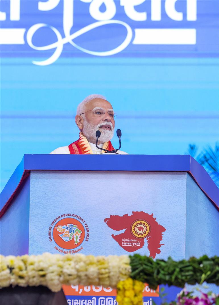 PM addressing the gathering at public function on the sidelines of the foundation stone laying, inauguration and dedication of multiple development projects to the nation held at Khodaldham ground (Ahmedabad), in Gujarat on August 25, 2025.