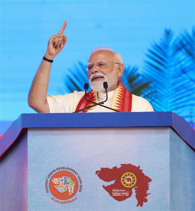 PM addressing the gathering at public function on the sidelines of the foundation stone laying, inauguration and dedication of multiple development projects to the nation held at Khodaldham ground (Ahmedabad), in Gujarat on August 25, 2025.