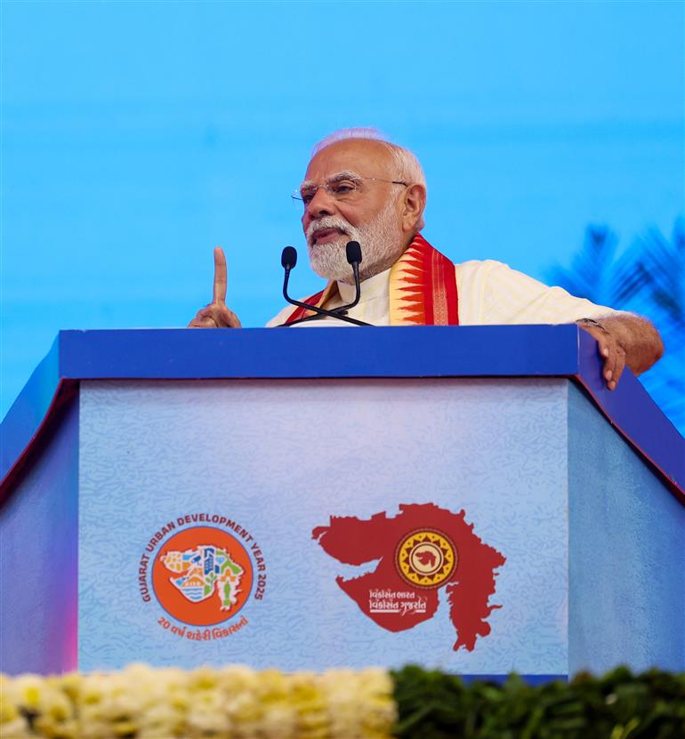 PM addressing the gathering at public function on the sidelines of the foundation stone laying, inauguration and dedication of multiple development projects to the nation held at Khodaldham ground (Ahmedabad), in Gujarat on August 25, 2025.